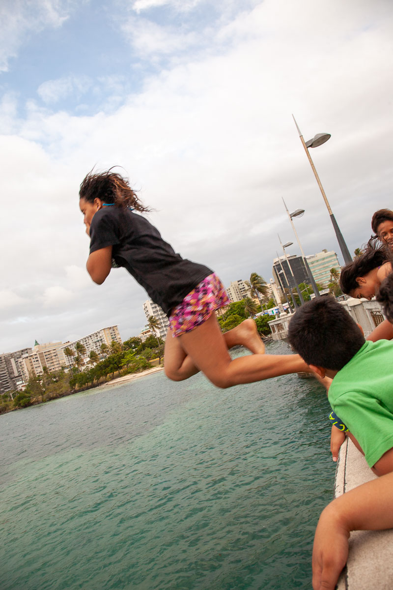 Girl Jumping off Puente San Antonio Bridge, San Juan