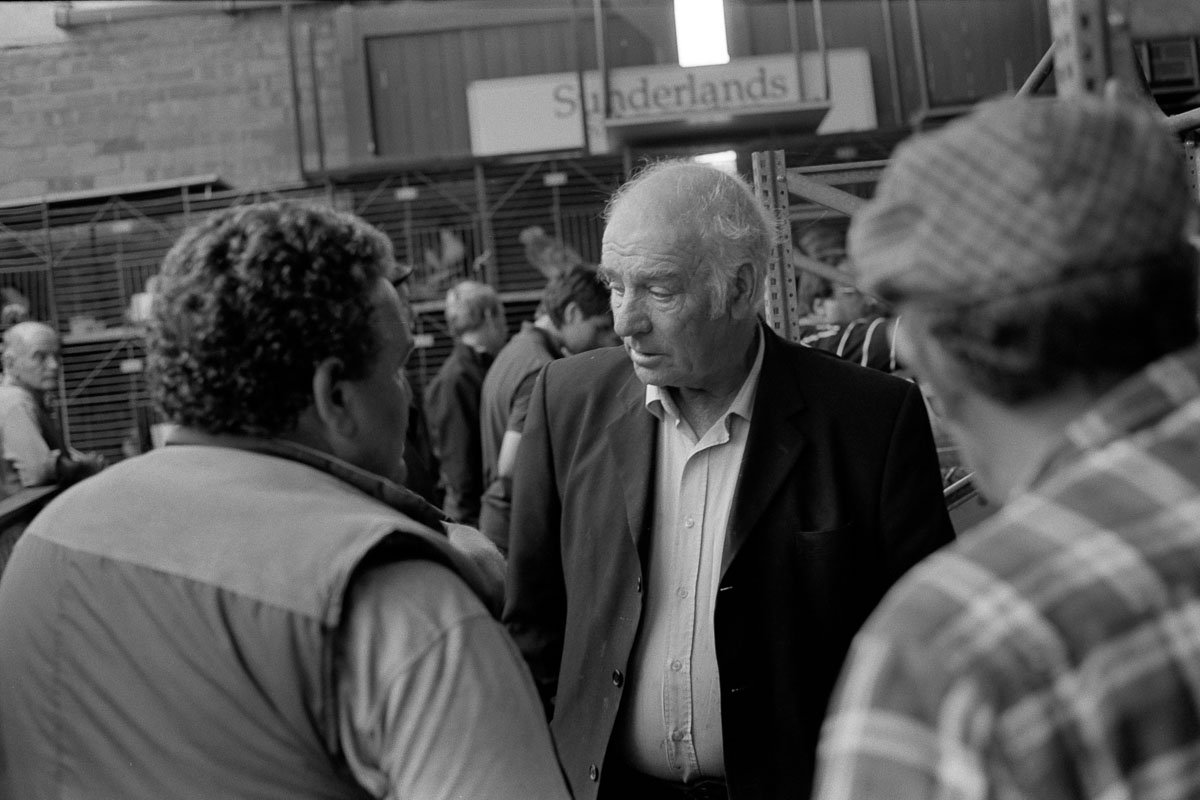Farmers Chatting at Hereford Poultry Auction 