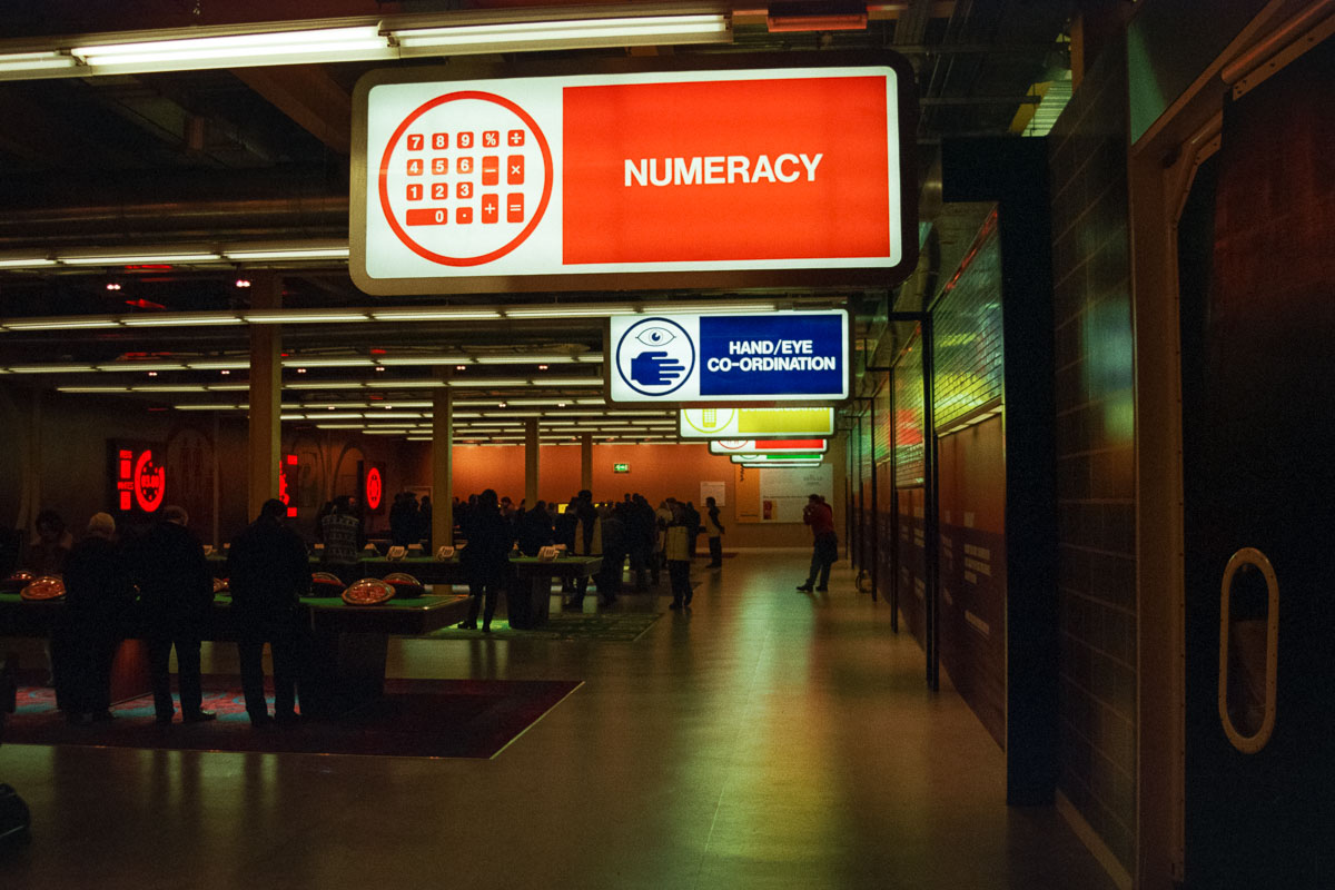 Visitors engaged with interactive games and challenges in the Work Zone