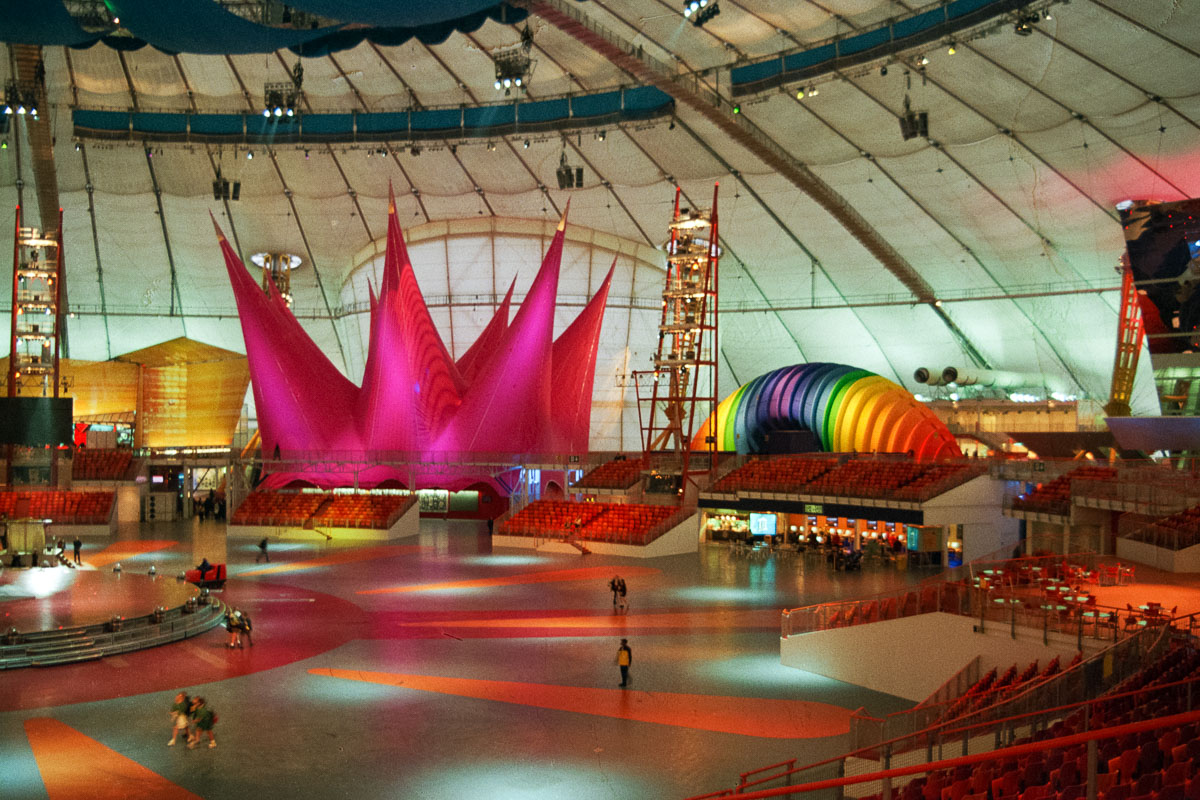 The vibrant Our Town Stage next to the calming, rainbow-coloured Rest Zone inside the Millennium Dome