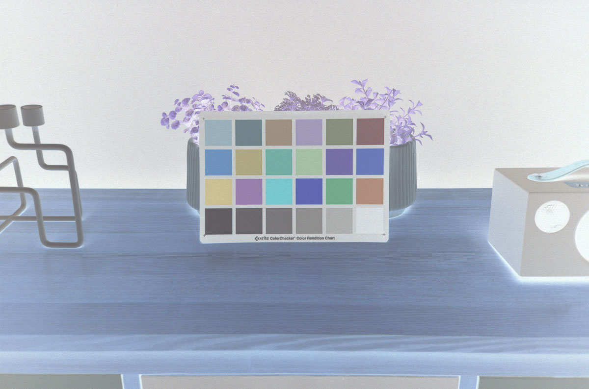 Invert colour negatives in Photoshop by assigning your film scan a linear colour profile.