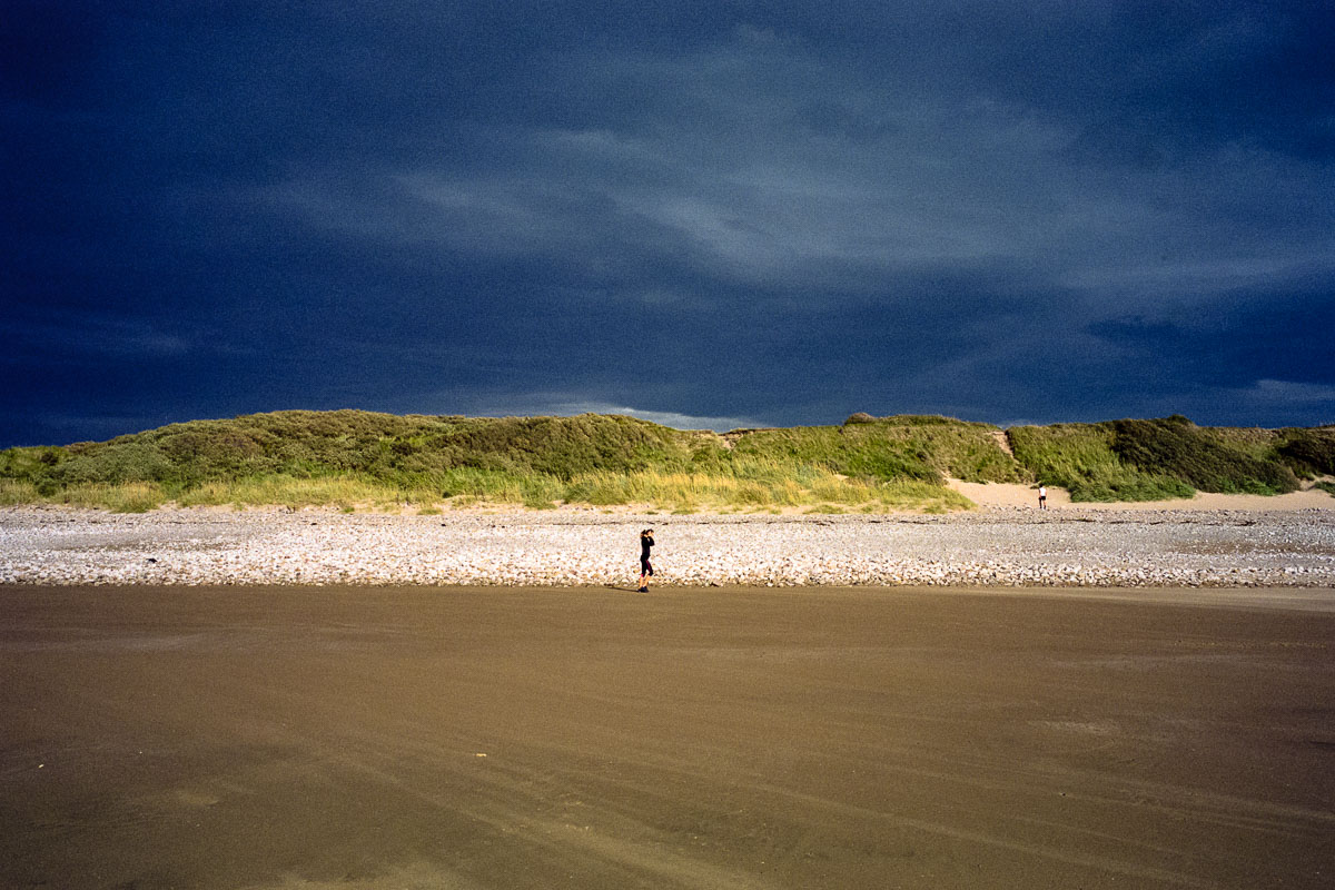 A lone jogger runs along West Shore Beach.