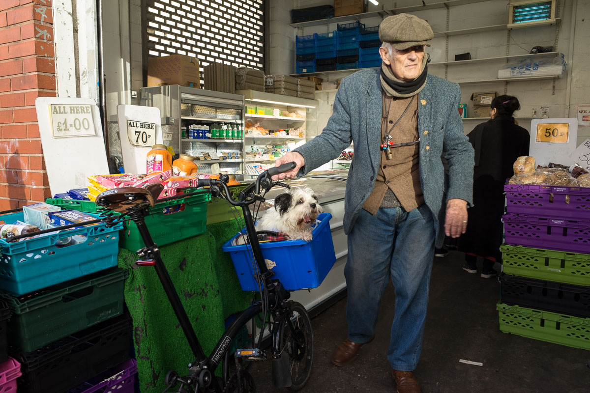 A regular at the Bullring Open Market with his dog in a wicker basket on his bicycle (a perfect street photography moment).