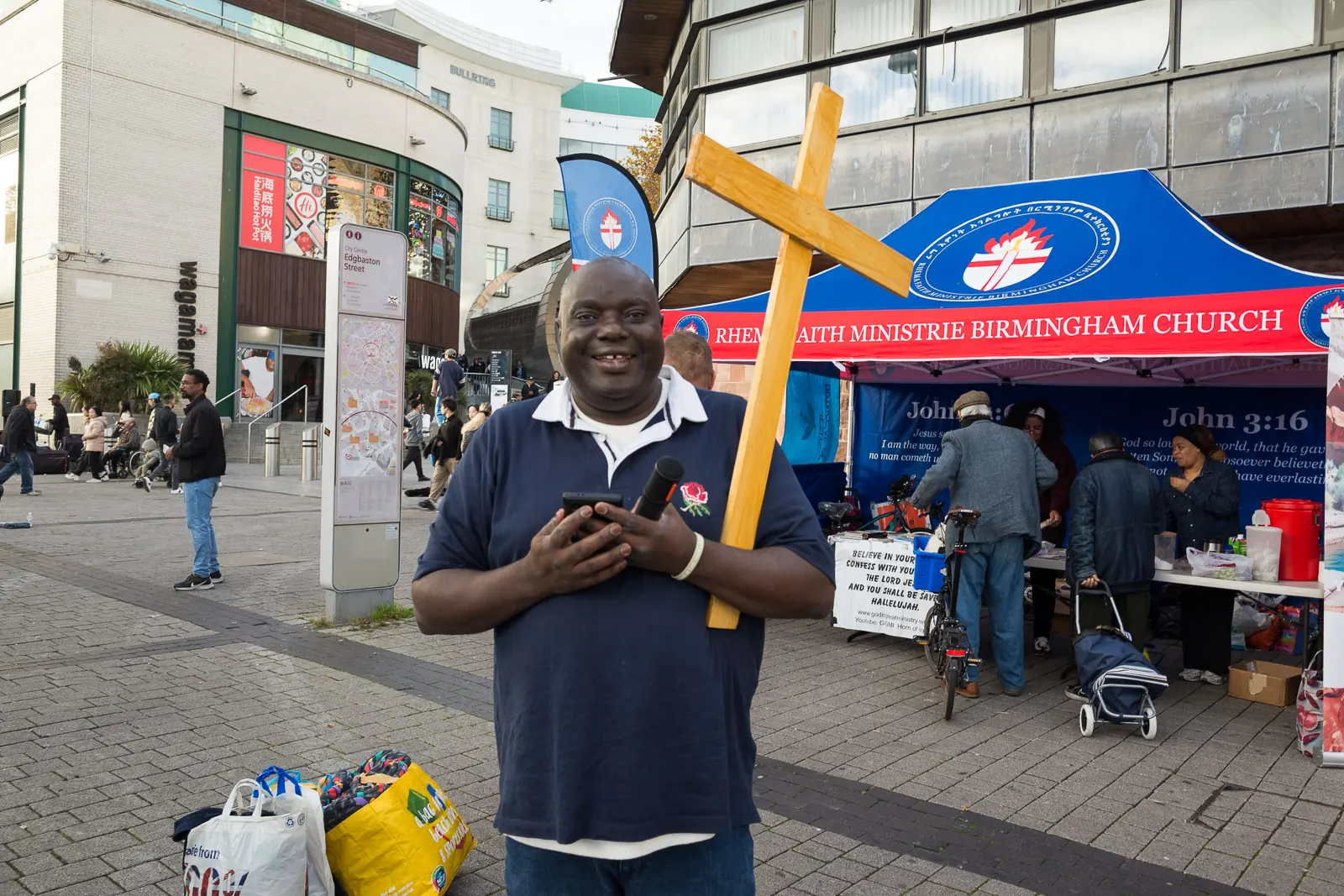 A pastor pauses for a photograph near the Bullring Open Market