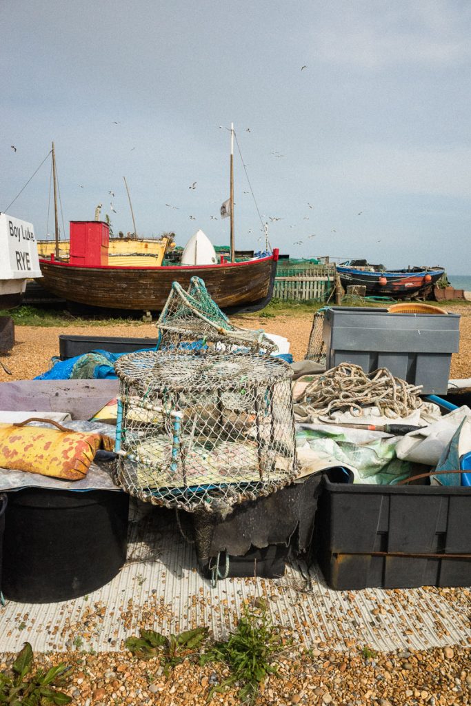 A typical beach scene with abandoned fishing boats and weathered equipment showcasing the town's enduring maritime history