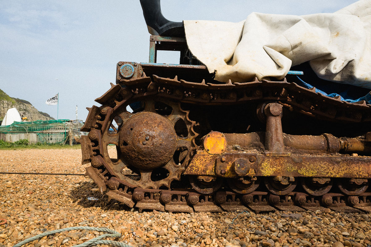 A rusting bulldozer on Hastings Beach—capturing the town's fishing heritage