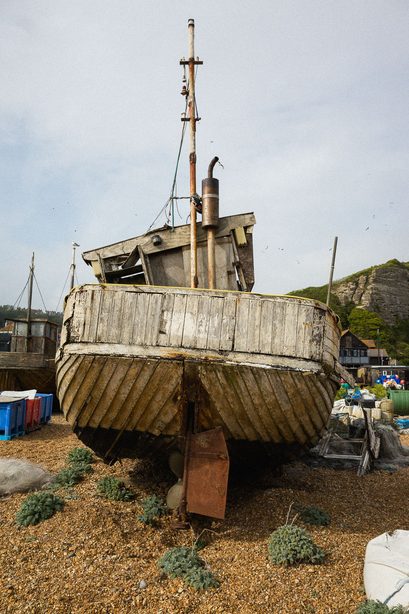 Old wooden fishing boat on Hastings Beach—an evocative subject for abandonment photography