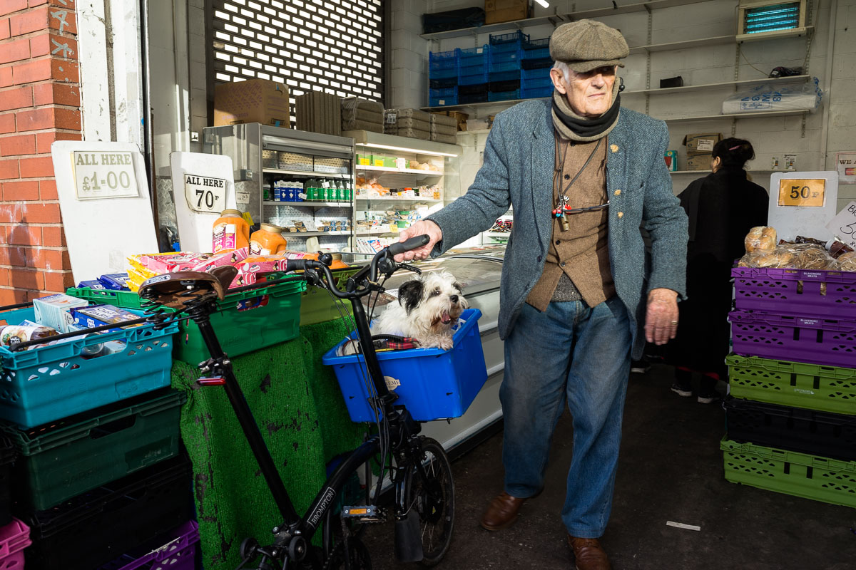 A familiar sight at the Bullring Open Market: a cyclist with his dog riding in a wicker basket