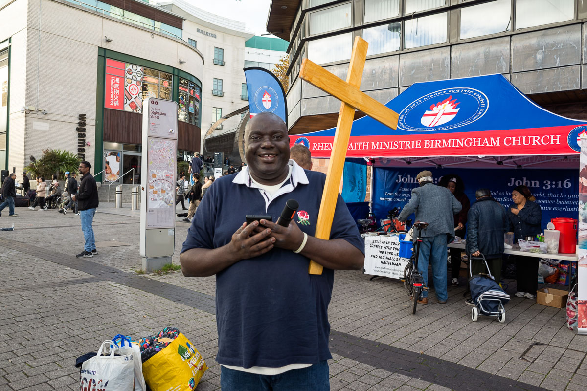 A pastor pauses for a photograph near the Bullring Open Market