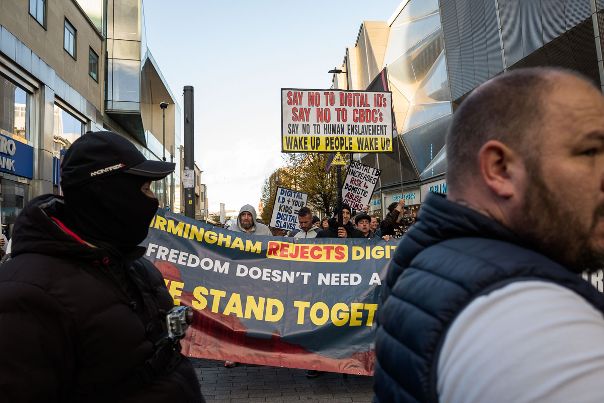 Protestors gather with placards calling for opposition to digital ID