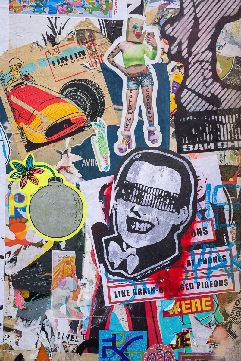 Layered graffiti and street art showing how images and messages accumulate on Brick Lane's walls