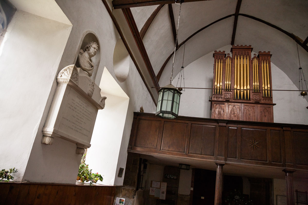 Marble bust of Mad Jack Fuller by Sir Francis Chantrey beside the large barrel organ he donated to Brightling Church