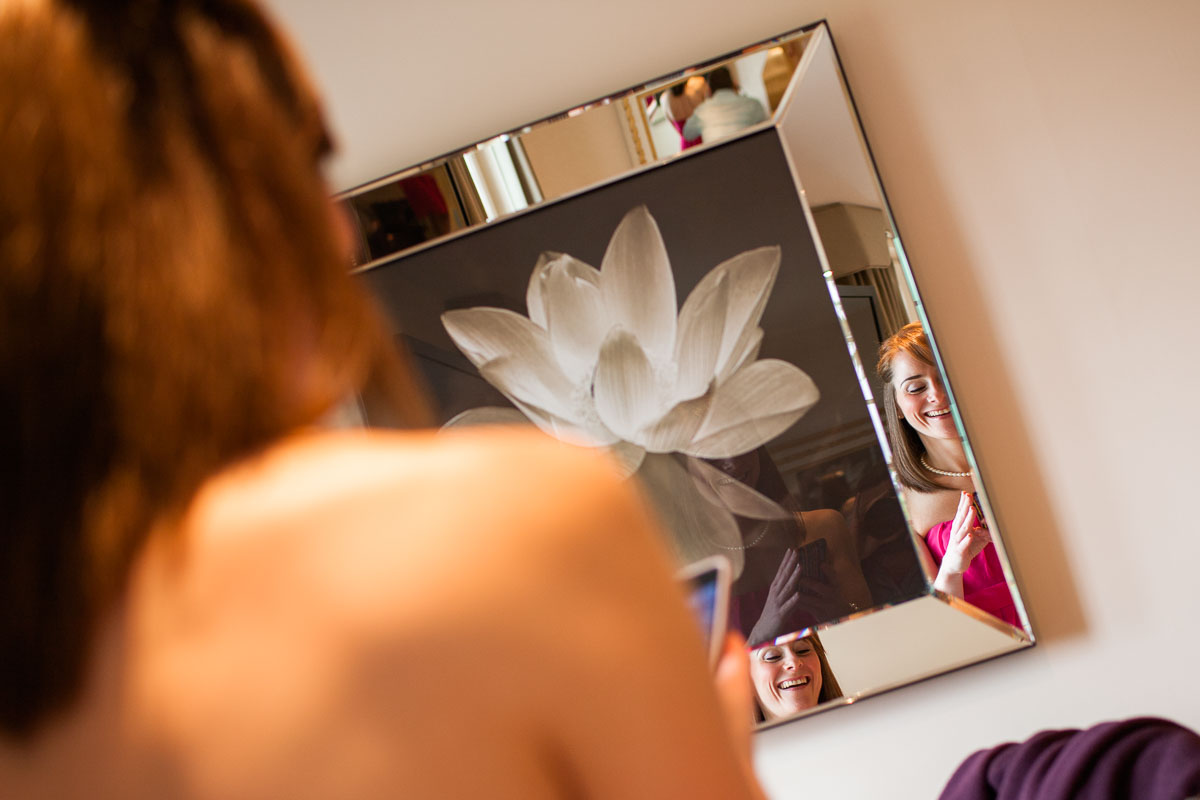 Many people take creative selfies using mirrors to play with reflection and perspective