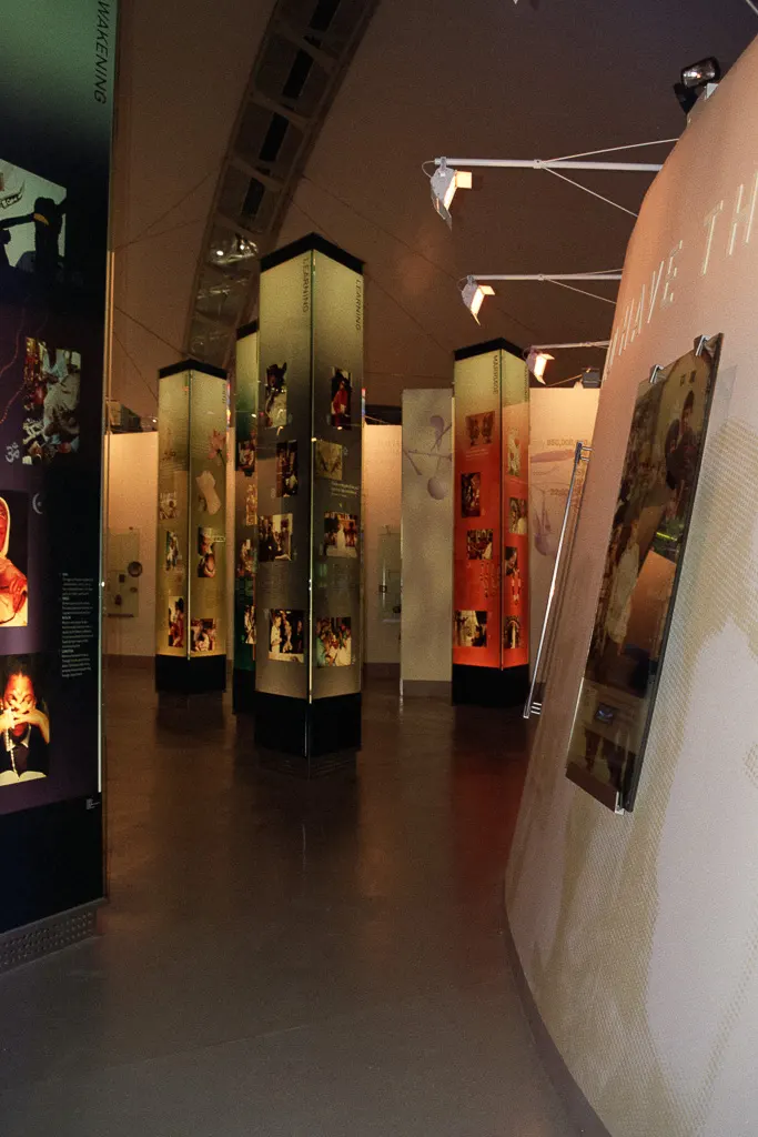 Nine pillars depicting birth, marriage, death—through the world's major religions