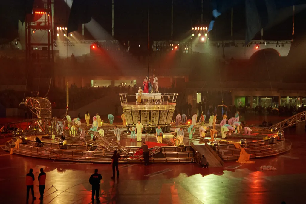 Performers captivate the audience on the central stage inside the Millennium Dome
