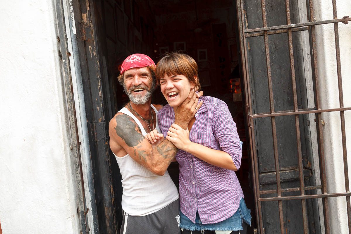 Couple ouside El Batey on Cristo Street, Old San Juan